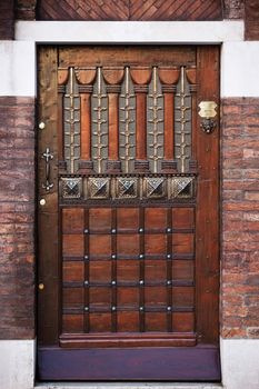 ancient door of the exterior house building in the beautiful city of venice in italy