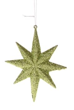 Golden glittering star shaped Christmas ornament isolated on pure white background 