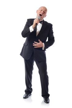 Man in a tuxedo singing isolated on white 