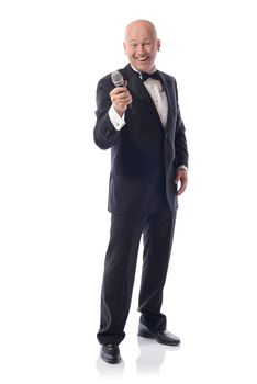 Man in a tuxedo offering microphone isolated on white 