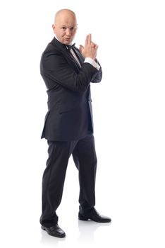 Man in tuxedo in a 007 james bond pose