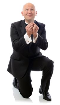 Man on bended knee proposing with a ring isolated in white background