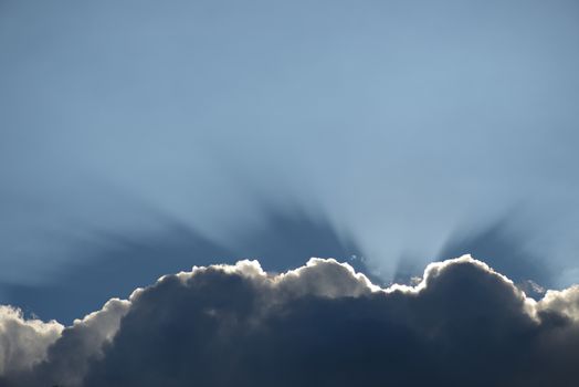 Cloud with a silver lining sun rays shining through that would make a nice boarder or footer to a page