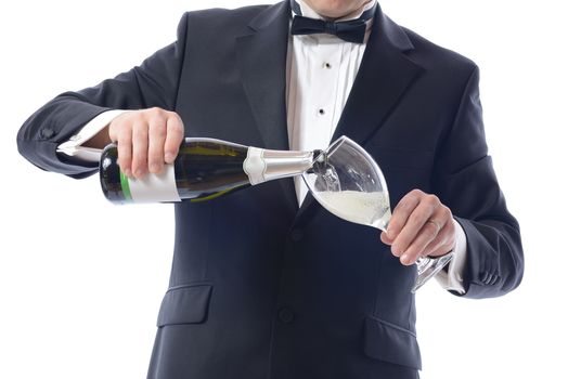 Man in Tuxedo Pouring Champagne isolated over white 
