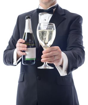 Man in tuxedo with a bottle of champagne and glass of wine
