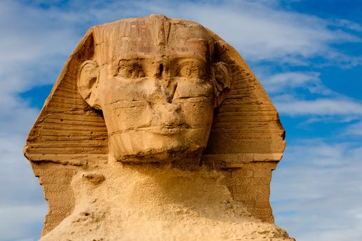 view of the sphynx with the pyramids of gizah near cairo in egypt