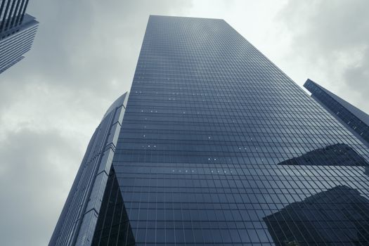 modern skyscrapers and dramatic rainy sky over them