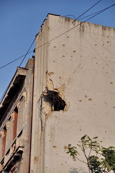 Bullet holes of the war on a damaged building in Bosnia Hercegovina