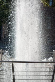 Splashes of fountain water on a sunny day