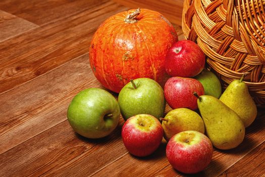Harvest of ripe fruits and vegetables: apples, pears and pumpkin