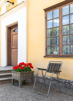 Classic Scandinavian architecture. Flowers decorating the entrance to the building.