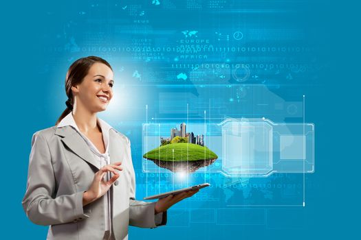 Young businesswoman with tablet pc in hands. Ecology concept