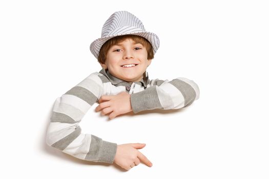 Little boy holding a blank white billboard