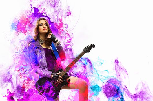 Young attractive rock girl playing the electric guitar