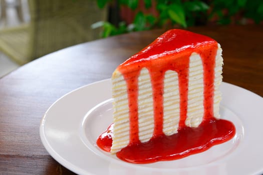 Homemade Crepe cake with strawberry sauce