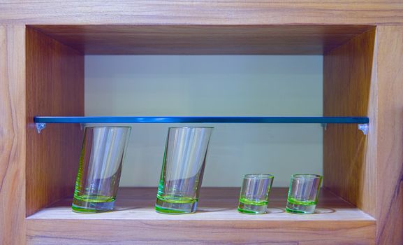 Four oblique glasses in wooden glass case