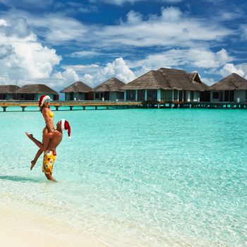 Couple on a tropical beach at Maldives