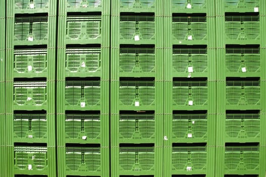 Green Fruit packing crates sitting on dock of packing house