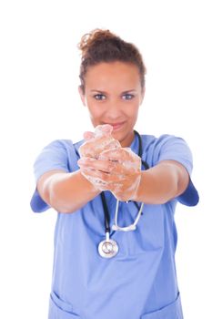 young nurse washing hands with soap isolated