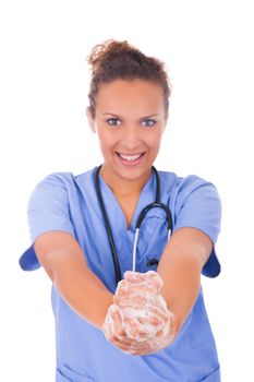 young nurse washing hands with soap isolated