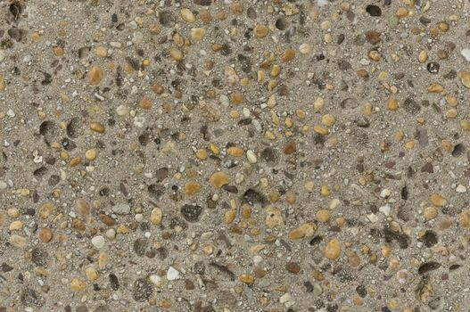 Distressed concrete surface with imbedded pebbles seamlessly tileable