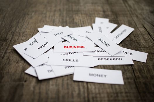 Paper strips with Business Concept related words on wooden background