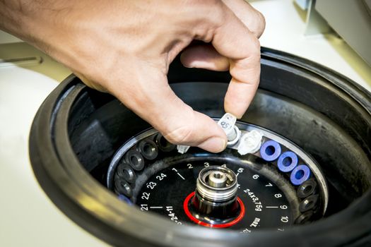 A centrifuge is equipped by a chemical laboratory with a sample.