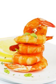 Gourmet Fried Shrimps Garnished with Lemon, Mustard Sauce and Thyme closeup on White plate