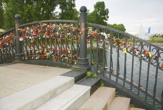 Bridge of lovers and honeymooners in the park