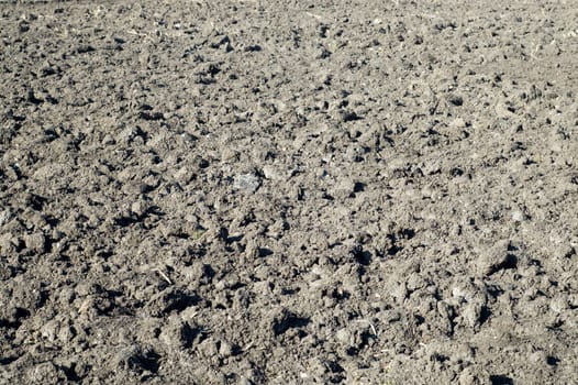 black ploughed field