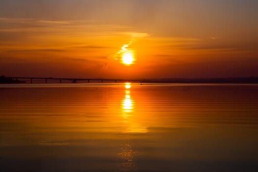 beautiful sunset over river with bridge