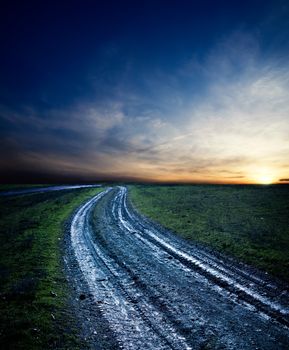 dirty way in sunset after rain