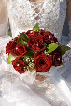 red fine rose in wedding bouquet