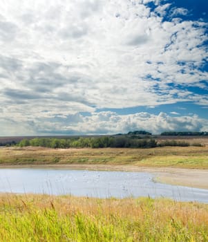 cloudy landscape with river