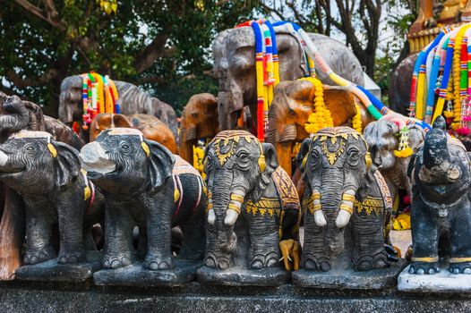 Thai stone elephant on a pedestal on a sunny day in Thailand