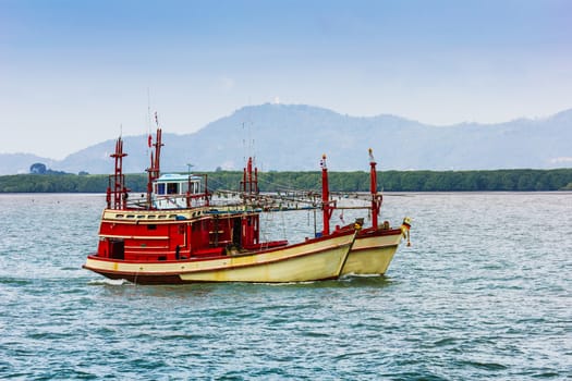 Boats at sea against the rocks in Thailand. Phi Phi Island