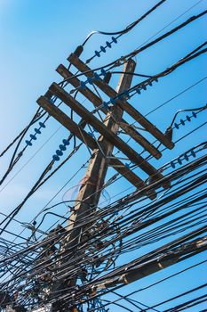 Intertwining of many electrical wires on poles