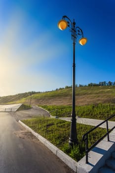 Street lights on the promenade on the shore of the great river