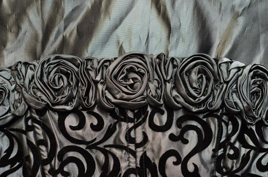 close up of black silk cloth with roses