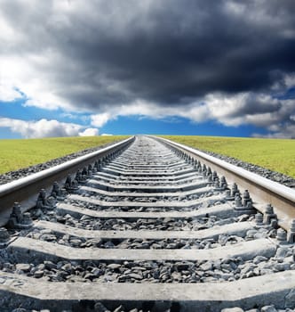 railway to horizon in green field