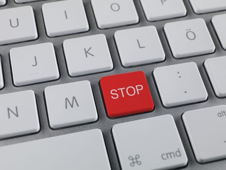 Close up of a red stop key at computer keyboard