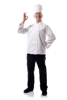 Male chef smiling with ok sign isolated on white