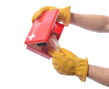 construction worker with glove taking a bandage from a first aid box