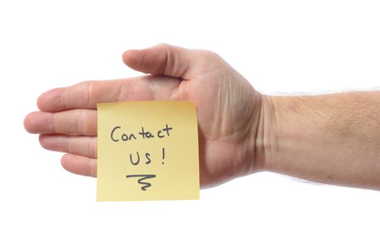 Hand woth post it note saying contact us isolated on white