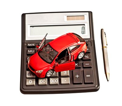 Toy car and calculator over white. Rent, buy, repair or insurance car concept