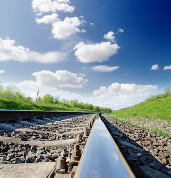 low angle view of railway under cloudy sky