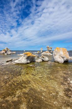 Sea stacks (raukar) on Fårö island in Gotland, Sweden. These limestone formations are caused by natural erosion.