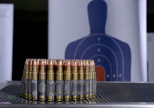 group of bullets and bullseye target