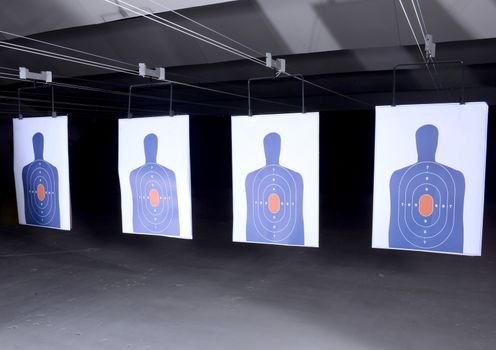 bullseye targets lined up at gun range