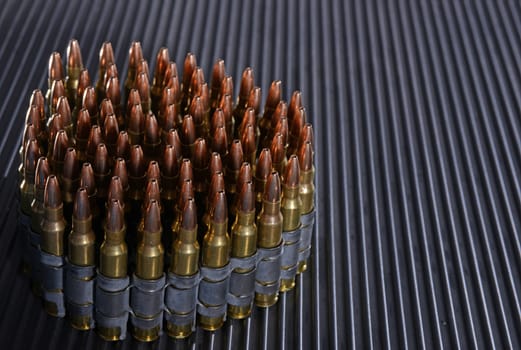 rifle bullets or ammunition on textured background